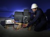 man with baker dx testing motor