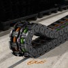 No guide trough energy chain system